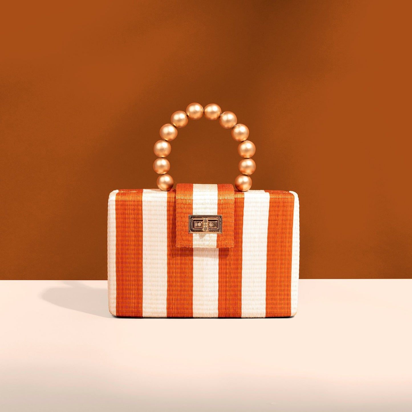 THE LOUISA Orange & Cream Stripe Woven Straw Clutch Bag